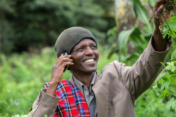 African man on phone