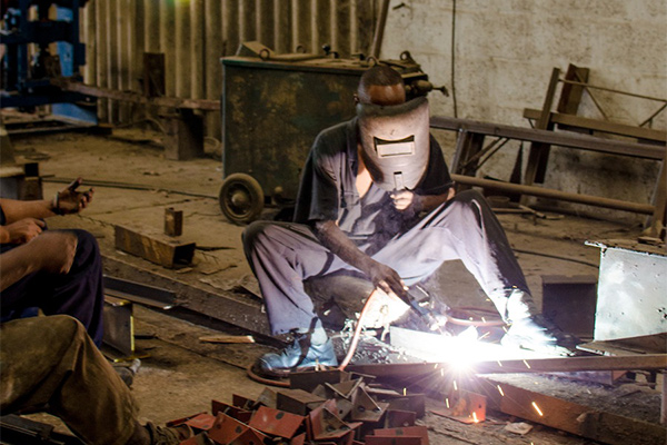 man welding
